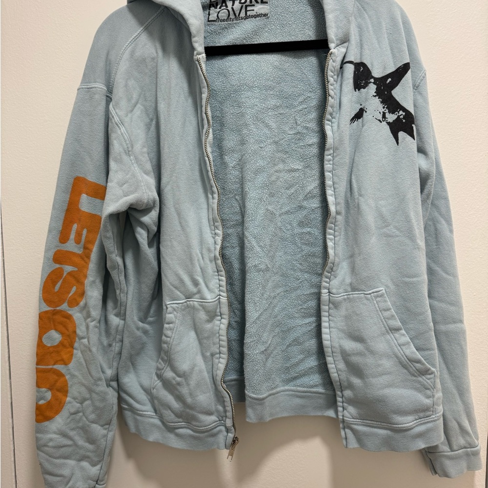 Freecity Light Blue Hoodie with Orange and Black Accents